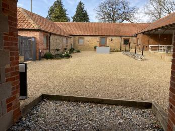 Step into the shared Courtyard from the Cart Shed.