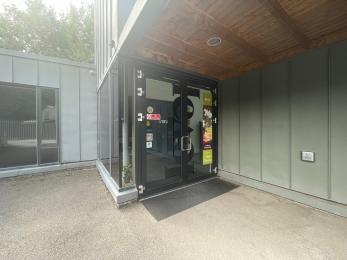 Main doors that open outwards with push button opening
