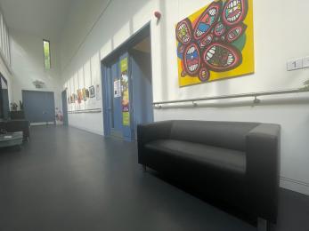 Corridor Gallery showing handrails and high contrast doors