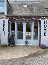 Exterior shot of entrance to the Deli & Home building. 