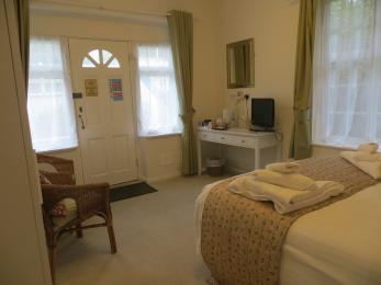 Selworthy double room showing seating area