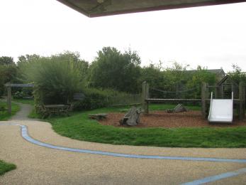 There is a picnic bench by the toddlers play area, and two within the garden (the entrance is to the left of this picture).