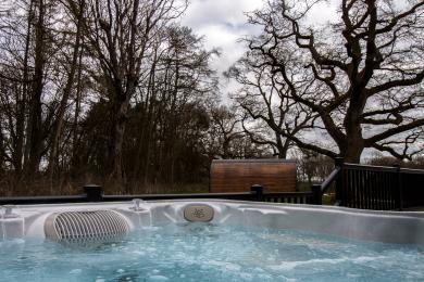 Relax in the hot tub at High Oaks Grange, Pickering