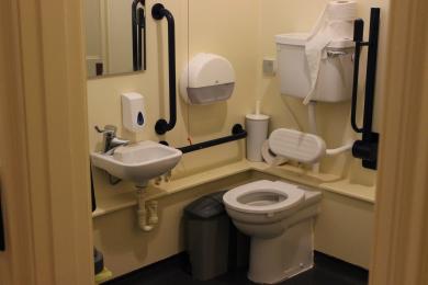 Accessible toilet on the right sink on the left