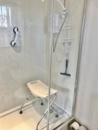 Folding Shower Seat and suction stability aid which can be moved to suit the needs of the user