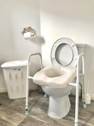 The raised toilet seat which is available to borrow at the Courtyard Studio if required