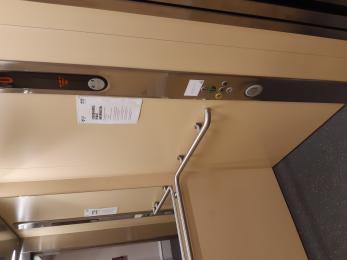 Interior photograph of Lift showing handrail and lift buttons