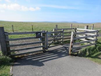Kissing gate between accessible parking spaces and Brodgar trails