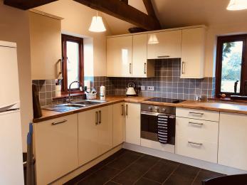 There is an open plan kitchen at the Vine House. Access to the building is via the Kitchen.