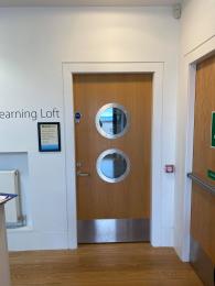 Image shows fire door into Learning Loft