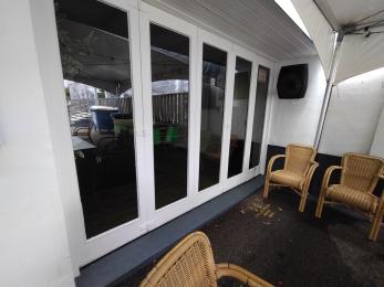 Bifold doors that can be opened up to a wide entrance way.