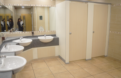 Image of toilets and sinks in the Men's toilets.