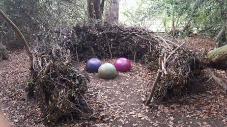 Large multi coloured 'monster eggs' in a nest