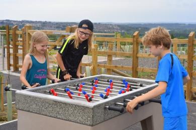 Outdoor table football on level ground near reception and coffee shop