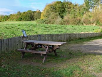 Accessible picnic bench at river viewpoint