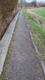 Compacted aggregate path with 100mm metal kerb