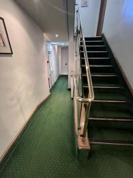 The hallway to the lift doors on the ground floor.