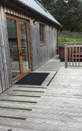 Decking leading to patio doors and hot tub