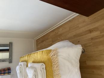Showing Space from bottom of bed to wall in double bedroom