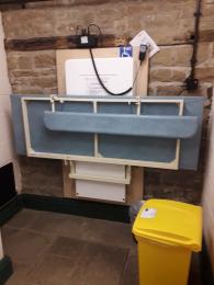 Changing table and hoist in the disabled toilet 