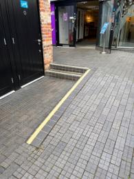 The ramp and steps to access the courtyard accessible toilet