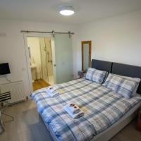 Room 1 with a double or two single beds and a sliding bathroom door.