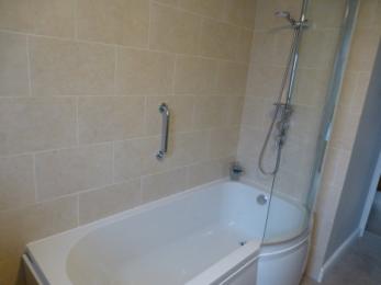 En-suite bath with shower over
