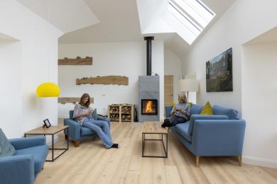 Slackbrae living area with 4m high vaulted ceiling, conservation rooflights and woodburning stove