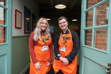 Story Guides and Visitor Service Assistants will be in Orange Aprons