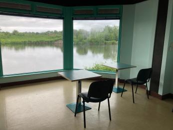 Inside Swan Lake Room looking out over Arun Riverlife lagoon
