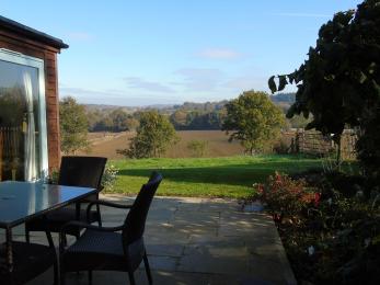Terrace with seating and views across spratsbrook farm