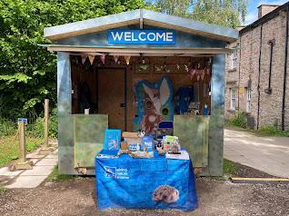 Visitor welcome hut showing information table