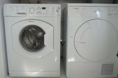 Washing machine and tumble drier in utility room.