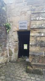 Door to view water wheel turning