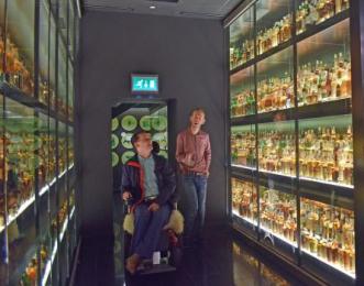 visitors inside the whisky collection room 