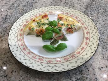 Frittata of goats cheese, mi-cuit tomatoes and chives.