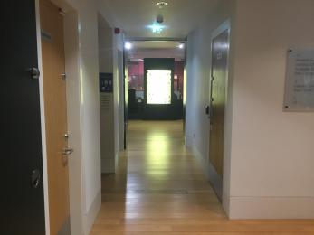 Image shows corridor between gallery one and two. The lift to the first floor is on the left. 