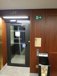 Image of ground floor lift 'outward opening door' notice