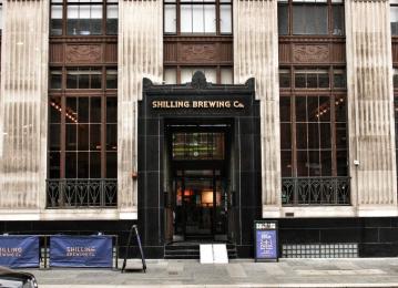An image of the large main entrance to Shilling Brewing Company, including an outside area and access ramp