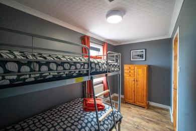 The Grey Suite bunk room showing part of bunk beds and wardrobe