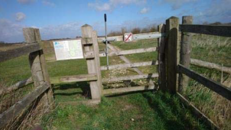 Kissing gate at the end of the trail before turning either left or right around July's Meadow