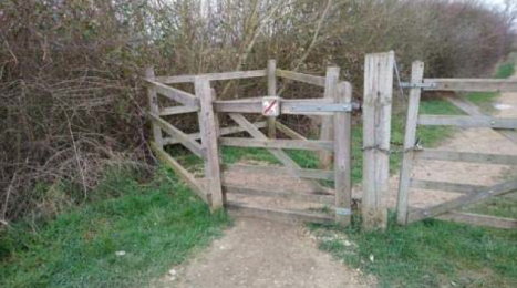 Kissing gate on the path to viewing screens with clearance of 130 cm