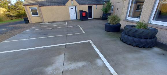 Partial view of car park looking towards The Pig Shed door