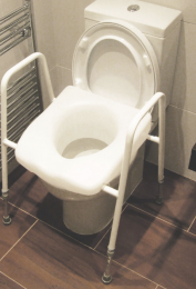 A raised toilet seat is available for use in the Garden Studio