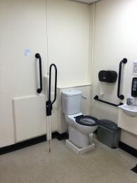 Stalls Accessible toilet interior showing grab rails