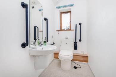 Downstairs cloakroom with Close-O-Matt shower w.c.  Wash basin with lever taps front transfer