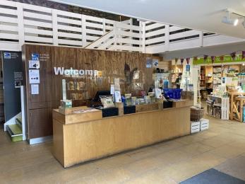 Visitor centre shop counter showing step access to café