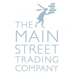Blue text saying 'the Mainstreet Trading Company' with a hare holding a stack of books above