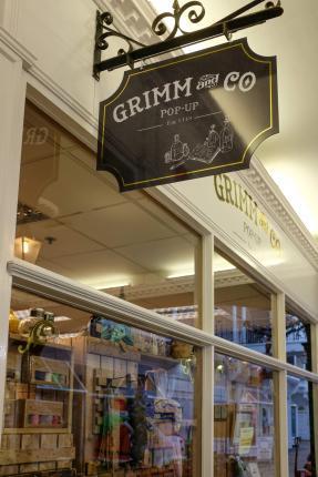 Grimm & Co Pop-Up Apothecary, written on a hanging sign outside a shop.