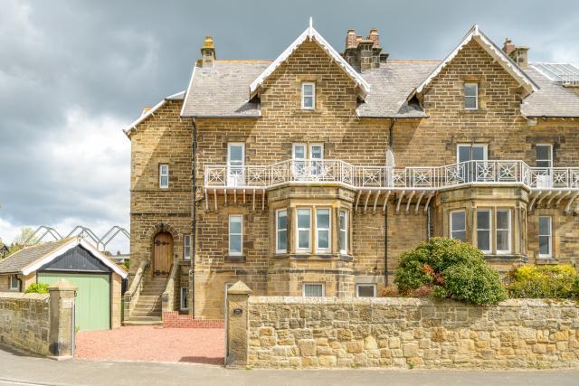 Front exterior of Prudhoe Villa in Alnmouth with direct sea views